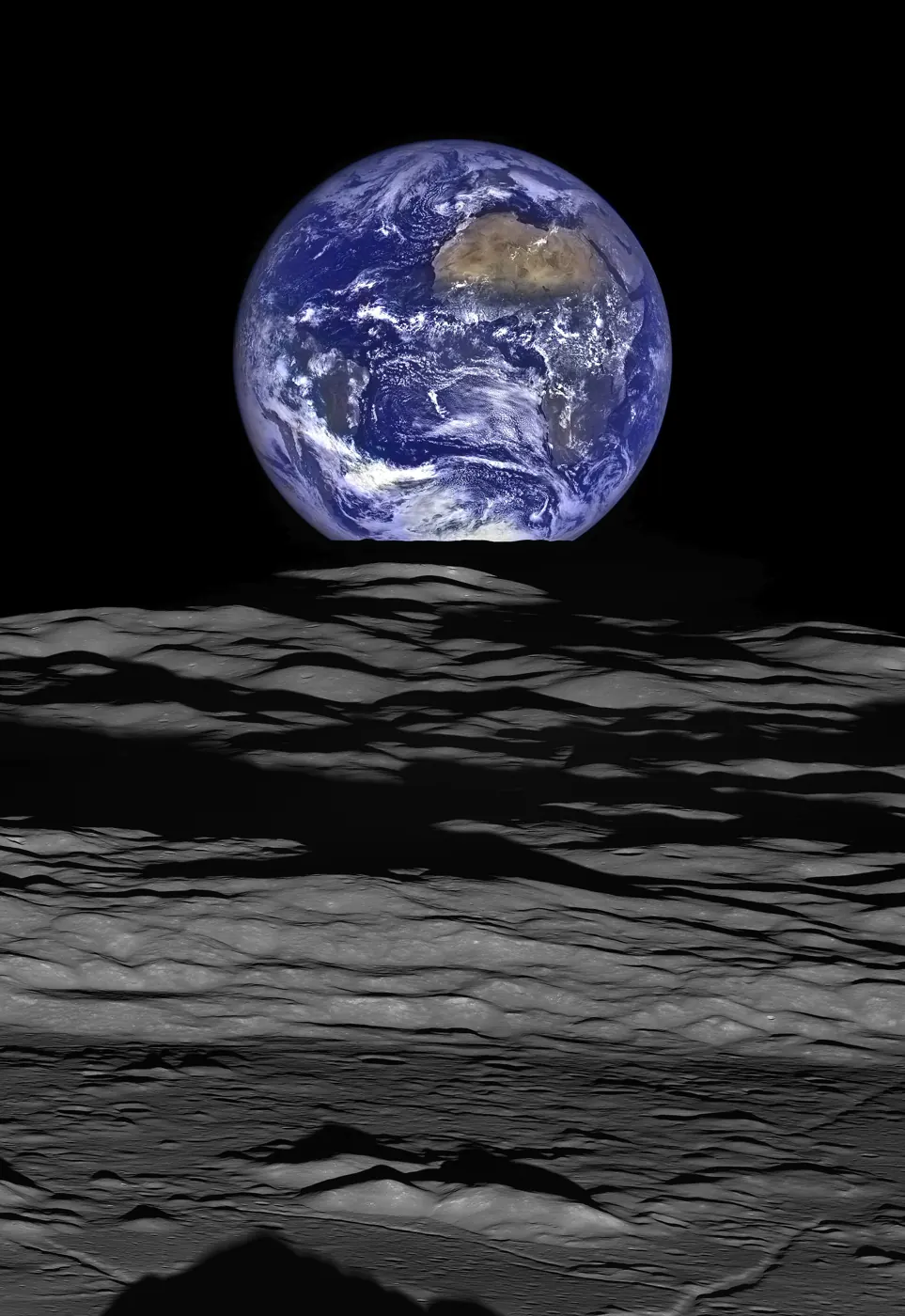 Earth rising over the Moon's horizon, seen from lunar orbit.